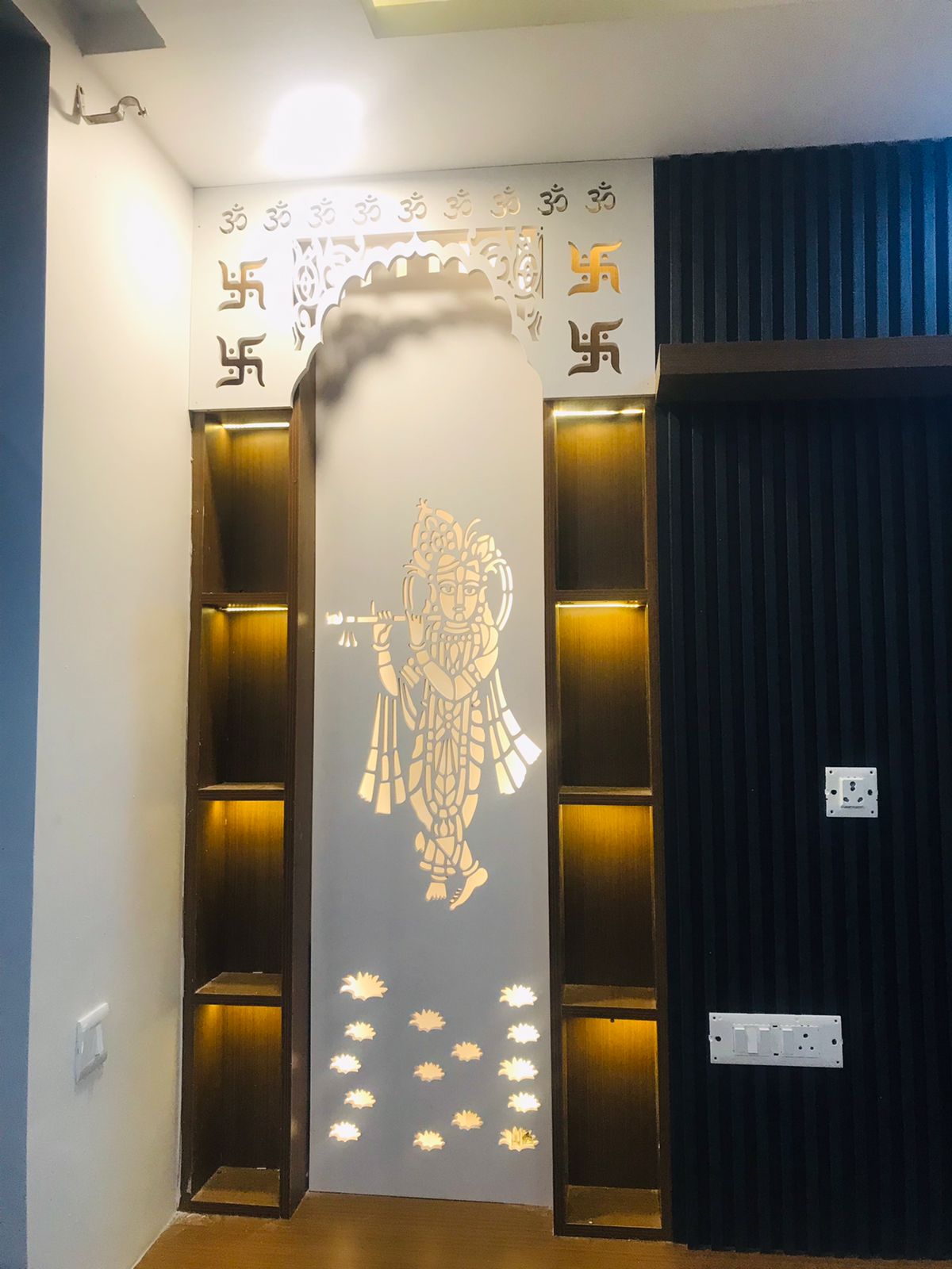 Completed puja wall panel with backlit shelves